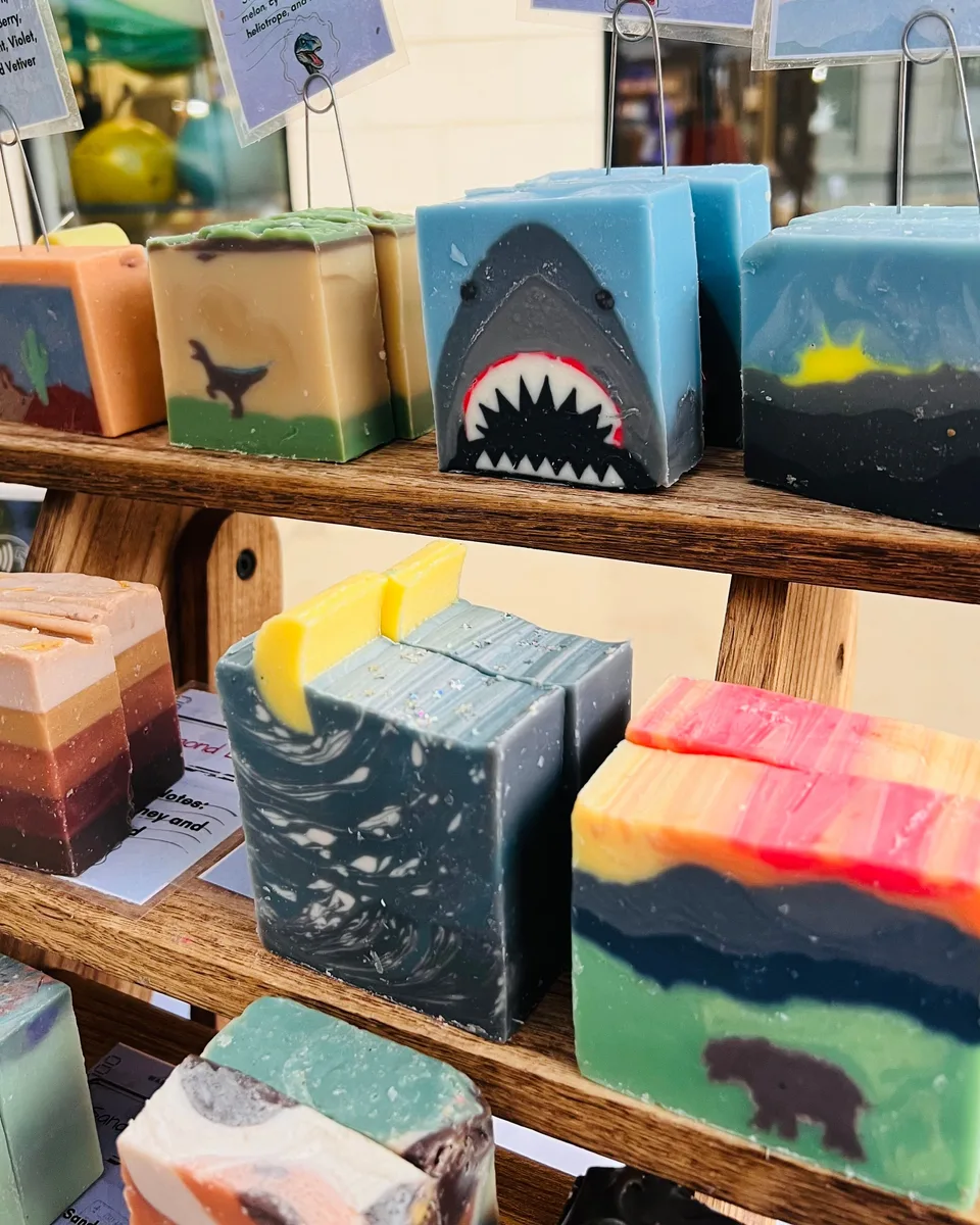 Colorful handmade soap bars with shark, desert, forest and landscape designs