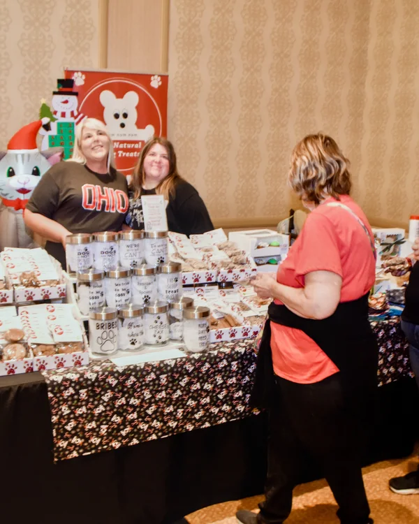 Guests meet an Ohio maker at a gift display.