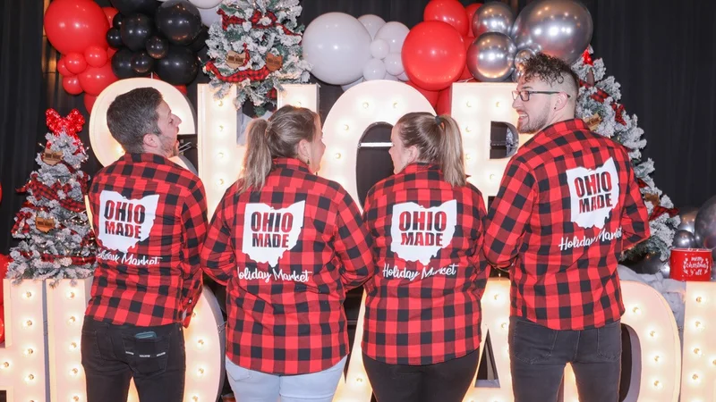 Four shoppers in plaid shirts show the Ohio Made back print.