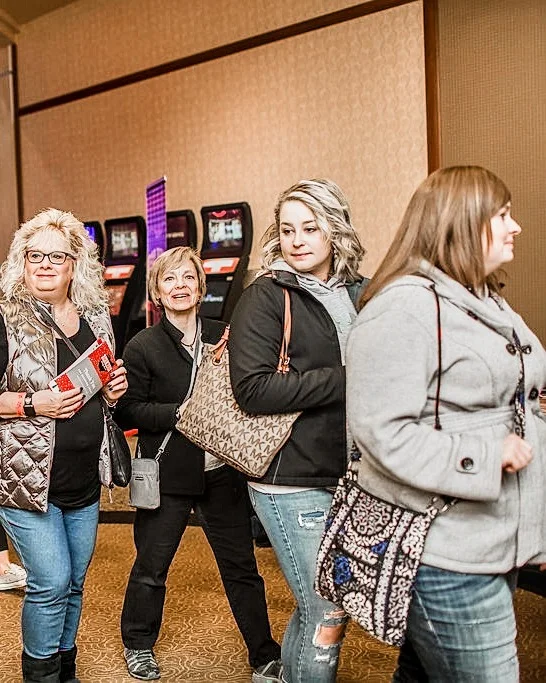 Smiling shoppers walk together through the 2017 Ohio Made Holiday Market.
