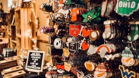 A maker booth rack hung with Ohio-themed ornaments.