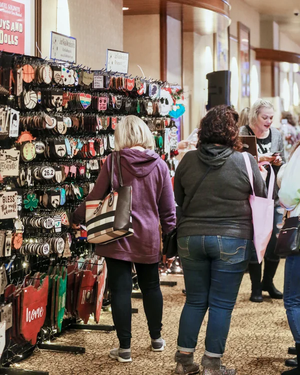 Shoppers browse a wall of handmade ornaments and keychains at the 2019 Ohio Made Holiday Market.