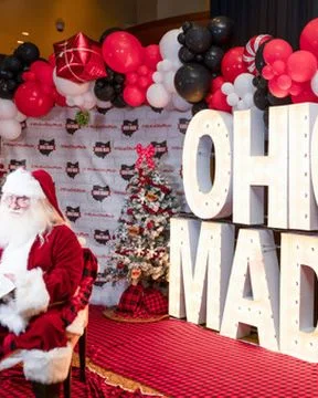 Santa sits beside the marquee Ohio Made letters.