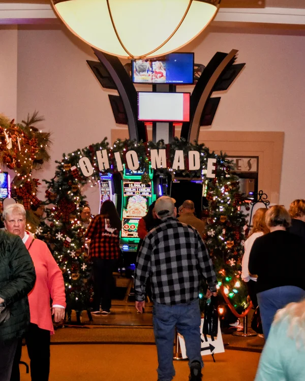 Guests walk toward the Ohio Made arch at the 2025 Ohio Made Holiday Market.