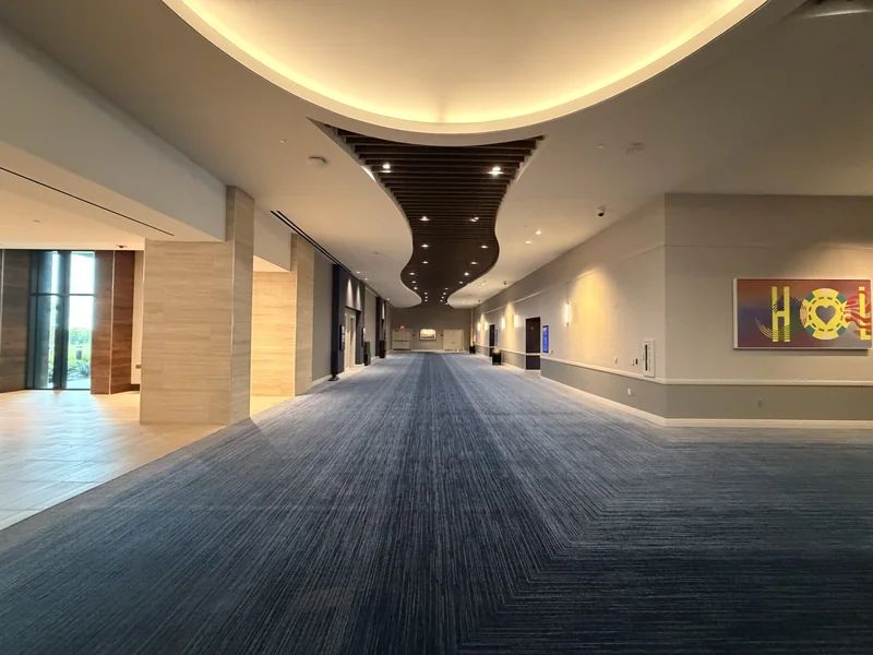 Carpeted connector from the hotel lobby toward the Event Center, October 2, 2026
